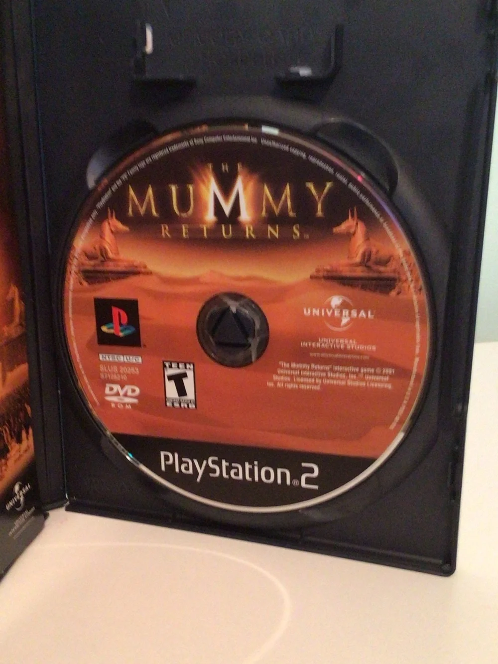 Sony PlayStation 2 The Mummy Returns (orange, black)